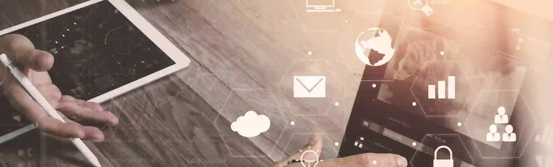 Futuristic 3D icons in focus with people working on tablets in the background.