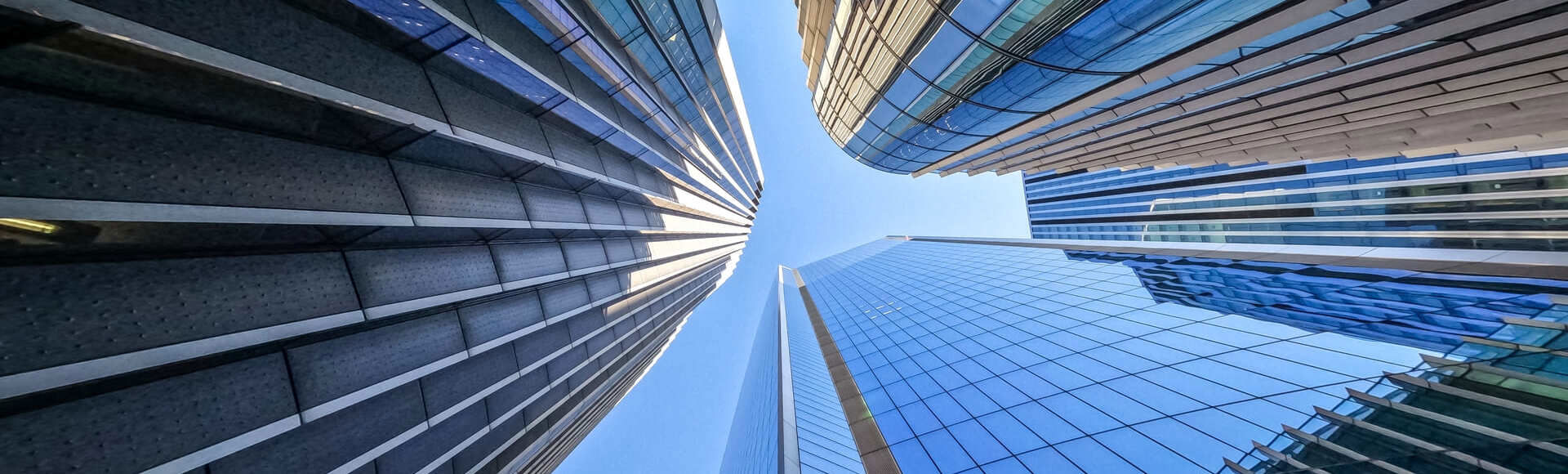 View of the sky framed by modern skyscrapers.