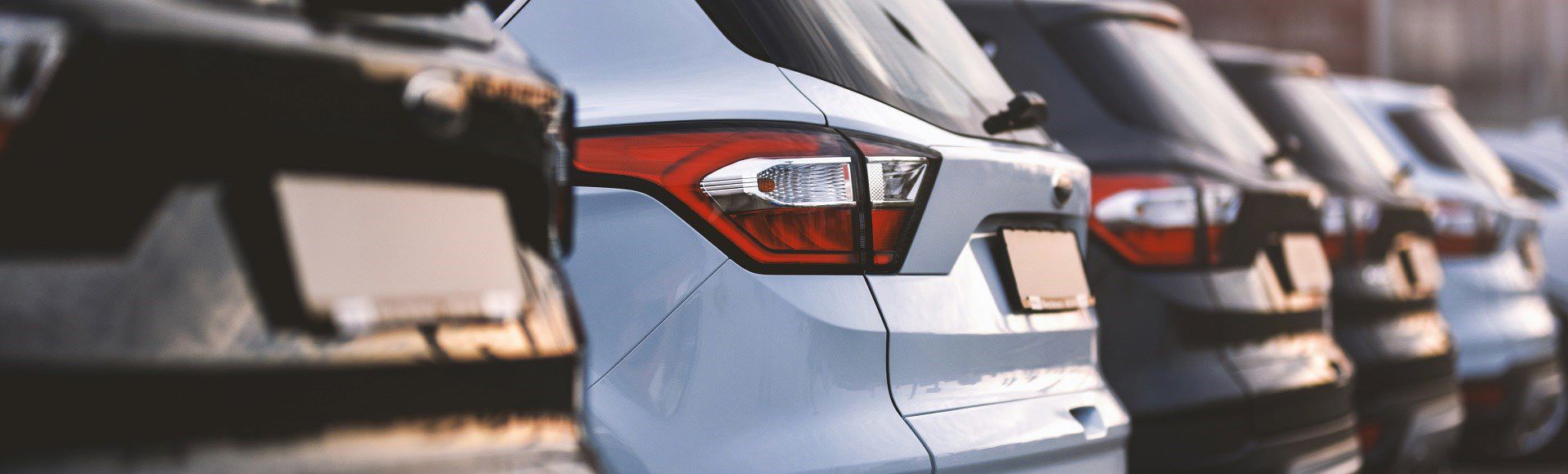 Cars parked in a row in a parking lot