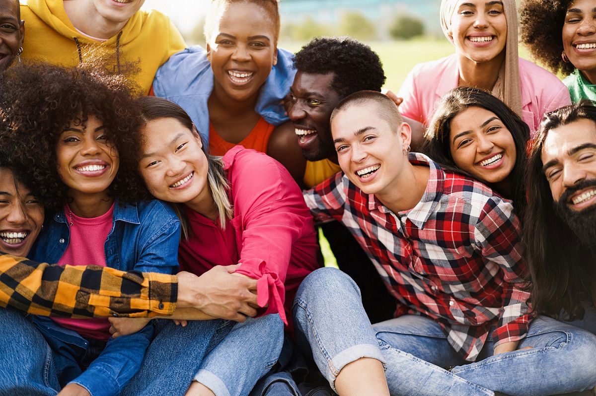Diverse group of smiling people having a good time on the outside