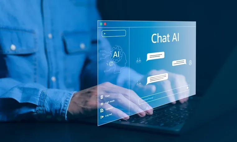 Person typing on a laptop with a virtual holographic interface displaying 'Chat AI' and chat bubbles, symbolizing artificial intelligence conversation technology. Person typing on a laptop with a virtual holographic interface displaying 'Chat AI' and chat bubbles, symbolizing artificial intelligence conversation technology.