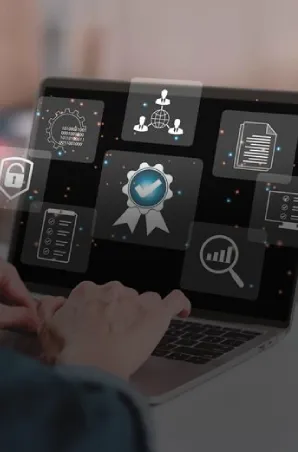 Business professional reviewing security, compliance, and analytics dashboards on a laptop.