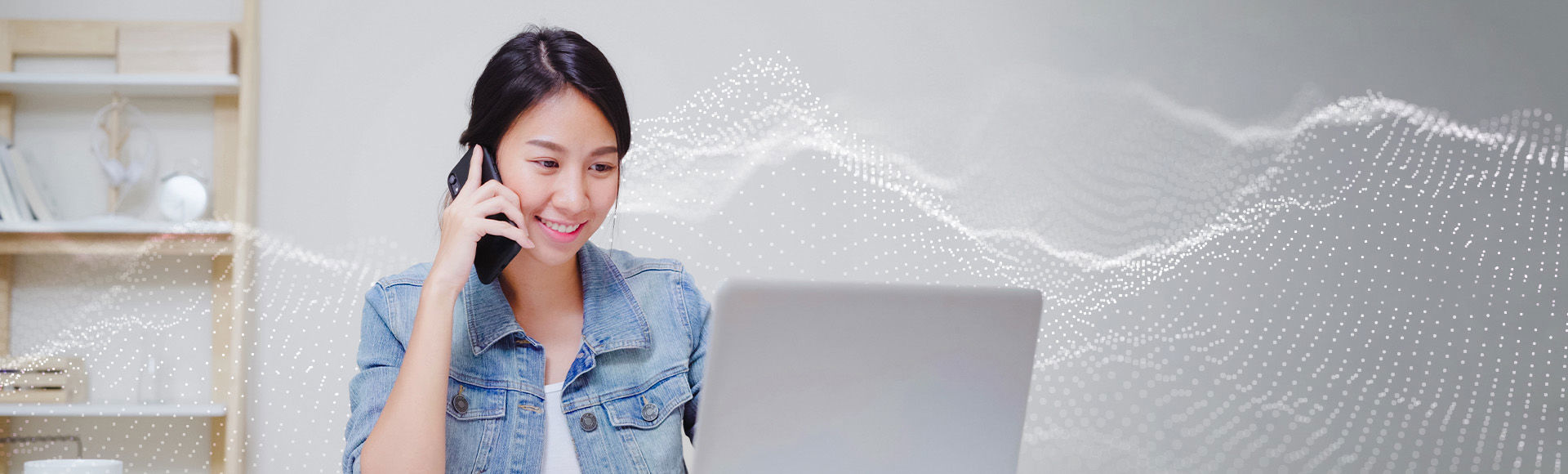 Smiling lady talks on phone while checking laptop amid digital sound waves.