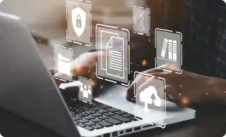 Person typing on a laptopn wisome 3D objects floating over the image
