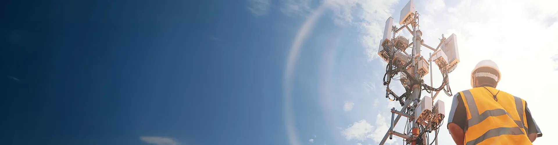 Man working on a transmission tower