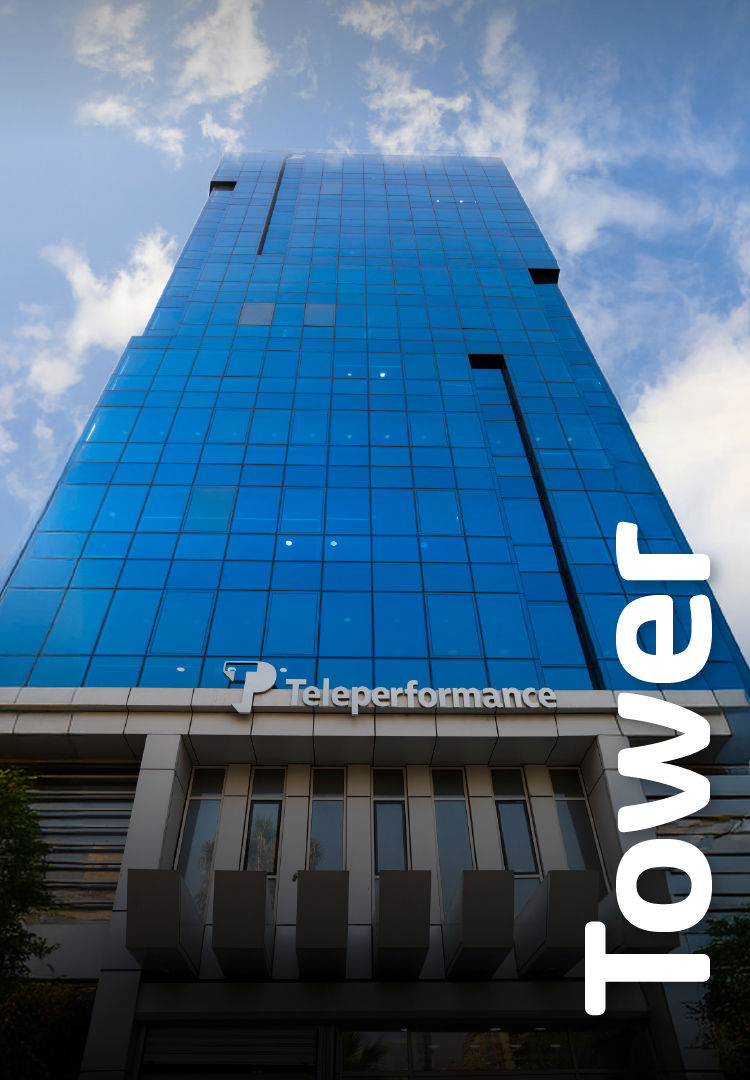 A tall, glass-covered building with the "TP" logo near the top stands against a blue, cloudy sky. The word "tower" is vertically positioned on the right side. A tall, glass-covered building with the "TP" logo near the top stands against a blue, cloudy sky. The word "tower" is vertically positioned on the right side.