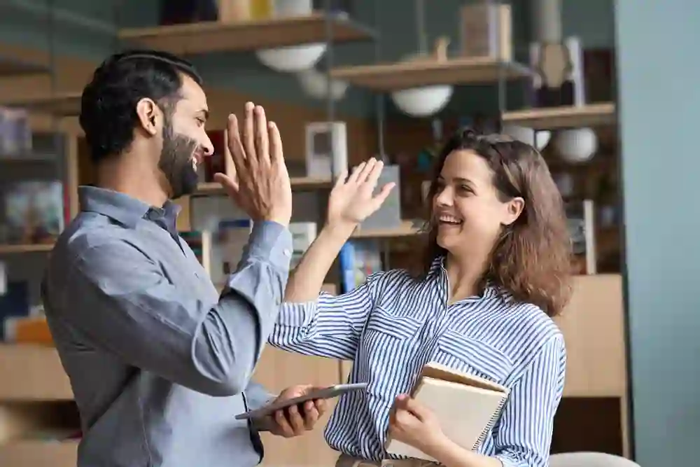 Team members celebrating with a high five