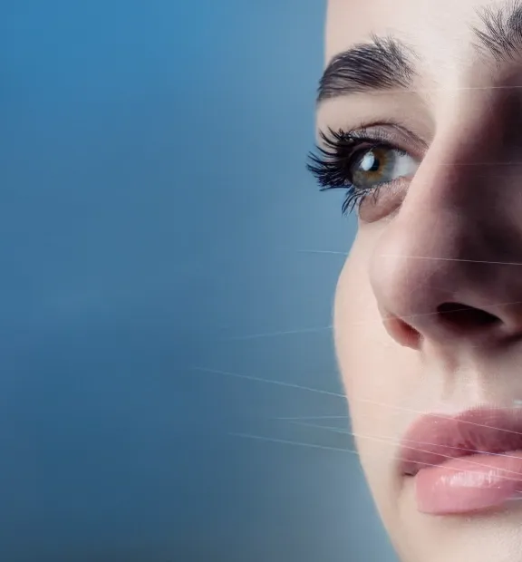 a close-up of a woman's face looking right; text reads, "unlock the power of agentic solutions" on a blue background.