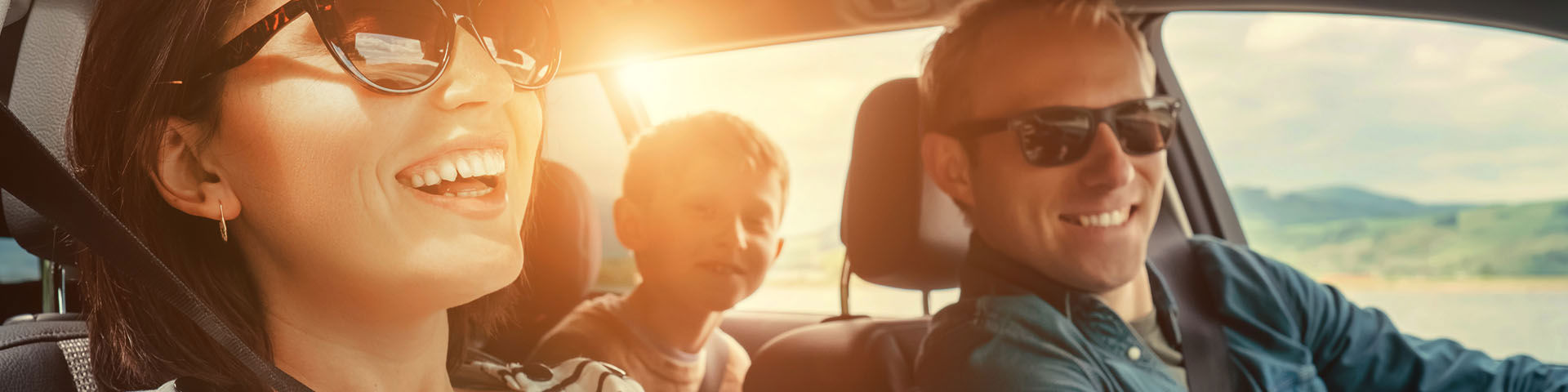 Family travelling by car on a road
