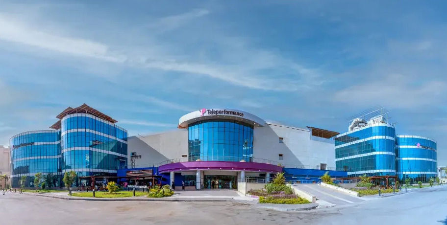 A modern building features curved blue glass facades with the "diablosport" logo prominently displayed.  A modern building features curved blue glass facades with the "diablosport" logo prominently displayed.