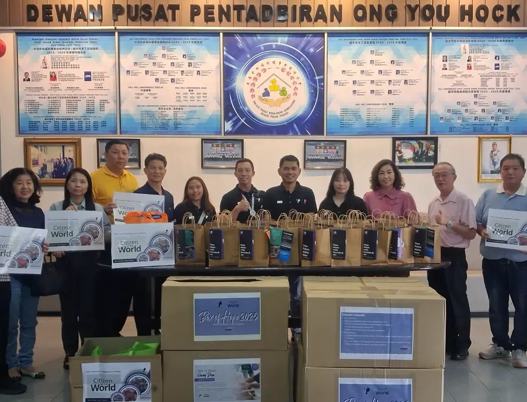 TP volunteers with community partners preparing donation boxes for the Box of Hope initiative.