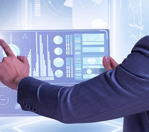 A businessman in a suit interacts with a futuristic touchscreen dashboard displaying data visualizations.