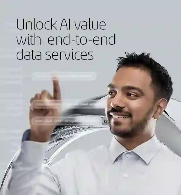 Smiling man interacting with futuristic interface showcasing data services.