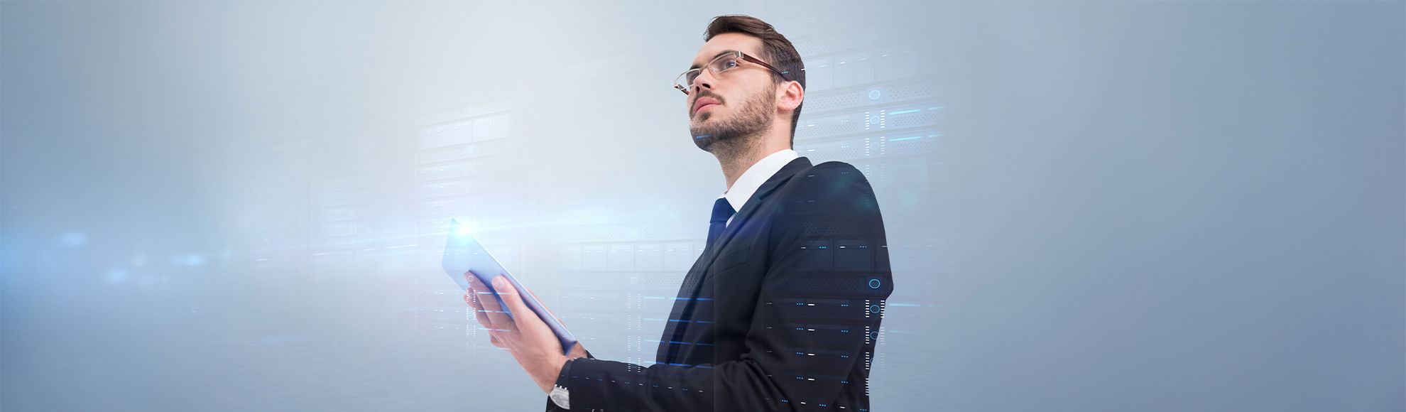 Businessman analyzing data on a tablet with digital interface, representing technology-driven decision making.