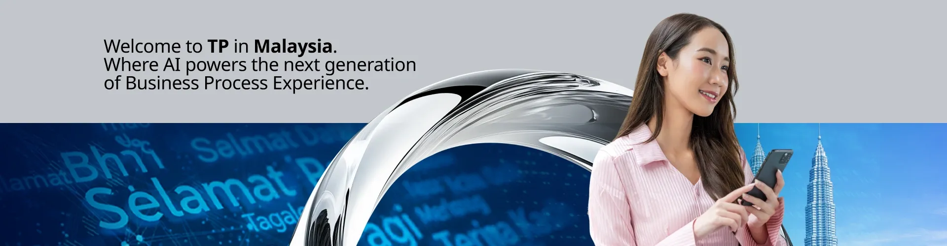 Malaysian businesswoman on her phone, illustrating TP’s AI-powered business process experience.