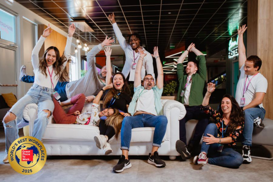 Team members celebrate a shared achievement, marking TP’s Top 10 World’s Best Workplaces 2025.