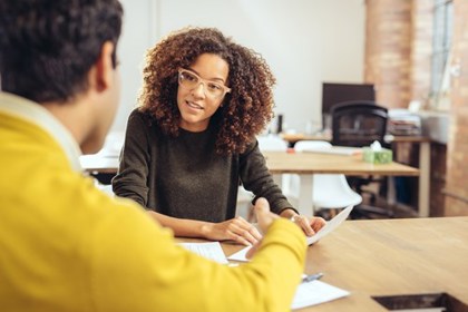 Man and woman working at an office