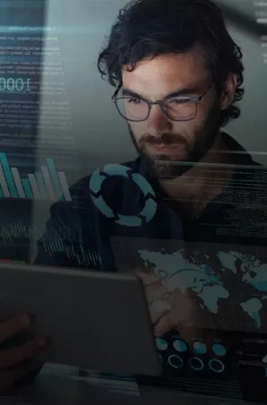 Professional analyzing data dashboards on a tablet in a modern office.