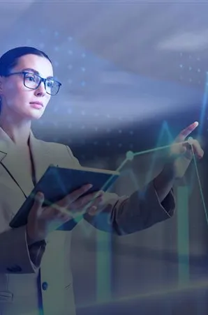 Business professional analyzing performance metrics on a digital dashboard.