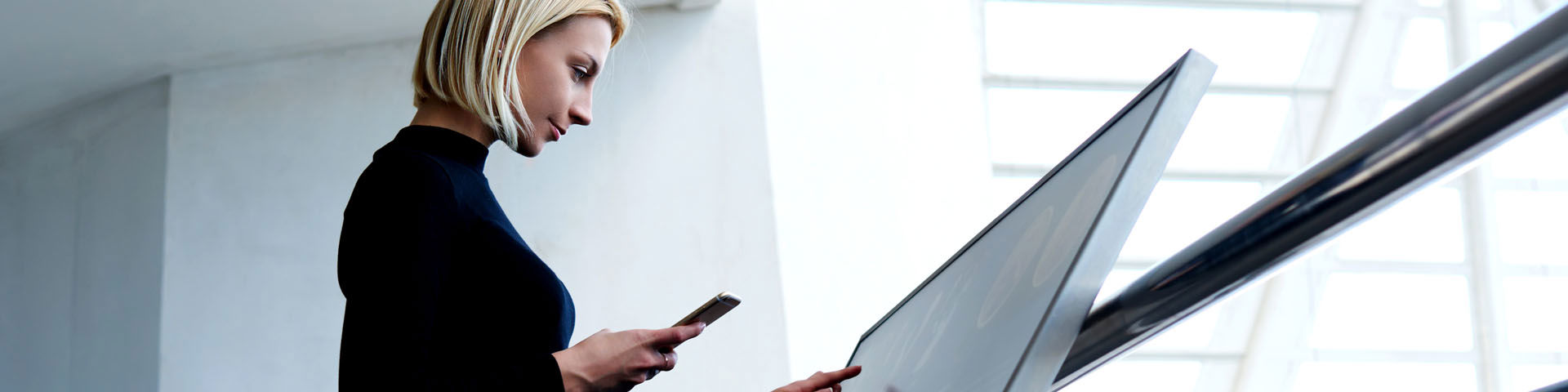 Woman interacting with a modern high-tech screen