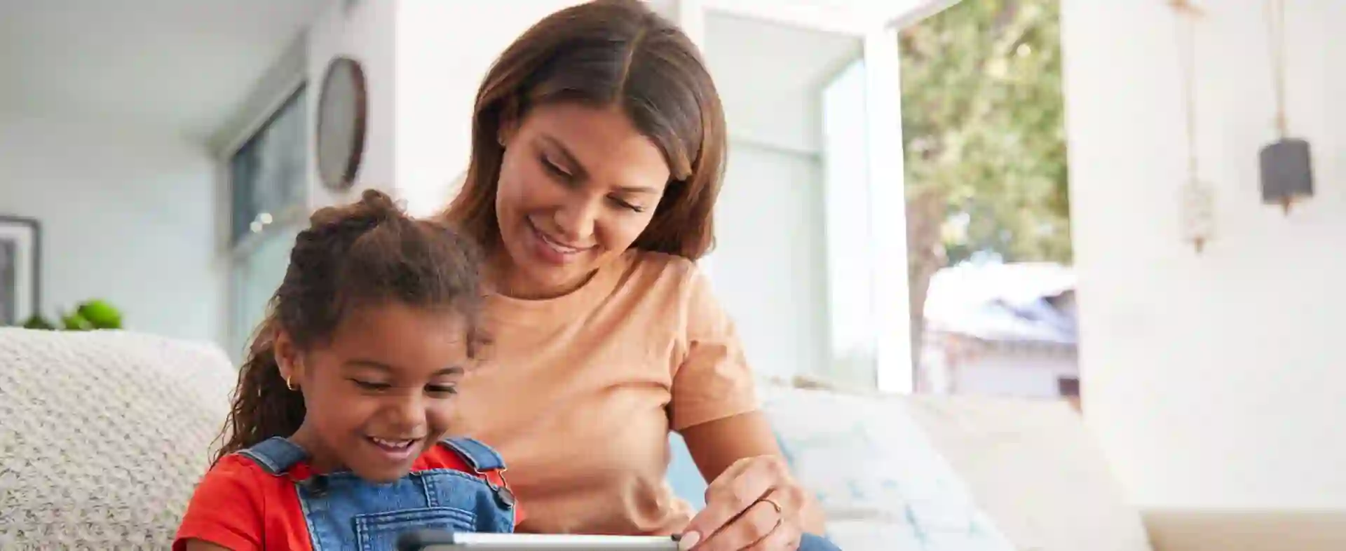 O ChatGPT disse:  Woman caring for a child, illustrating PR on supporting 60,000 children, including 10,000 from India, in 2022