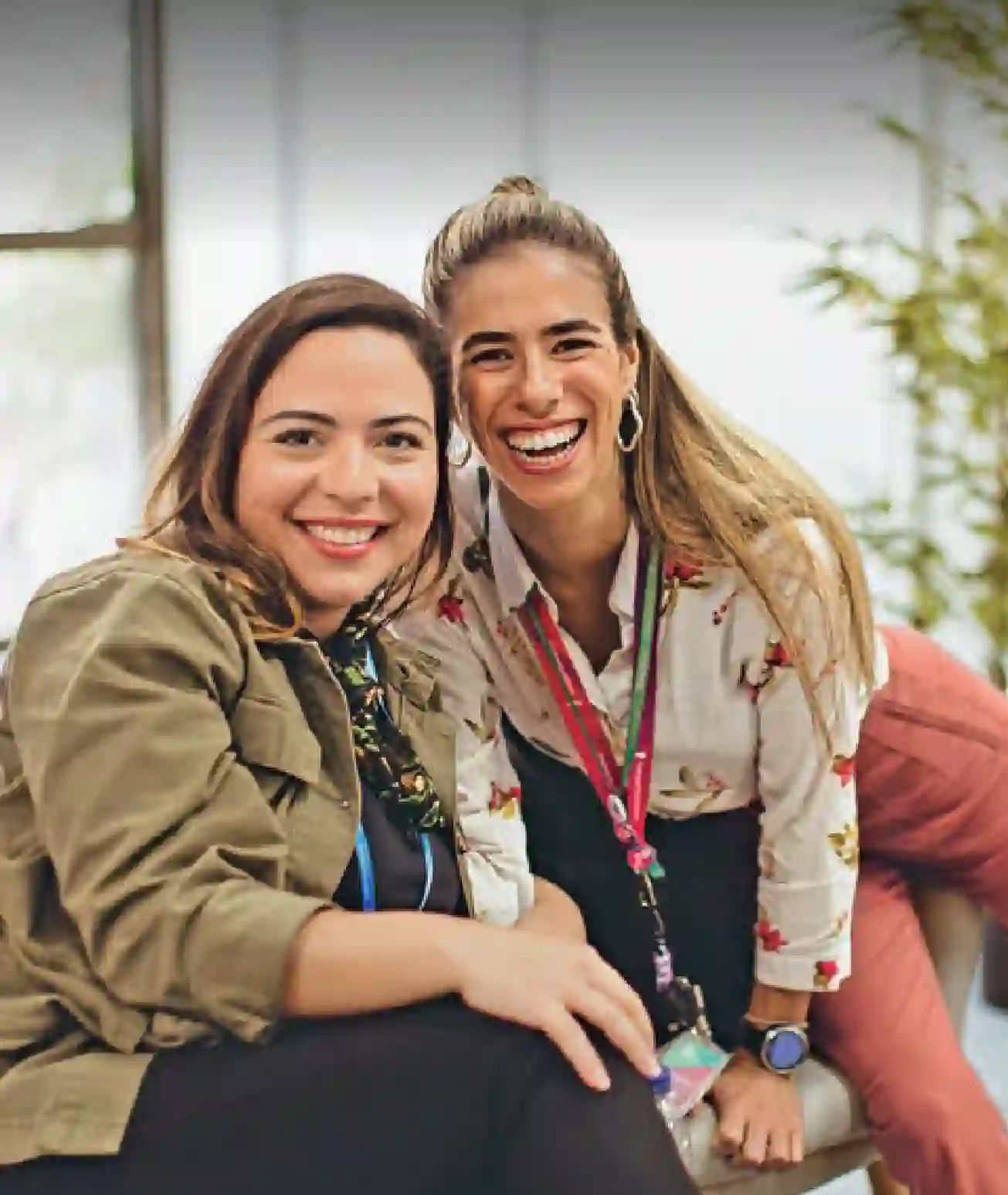 TP employees smiling and looking at the camera during a workday at the company’s office.