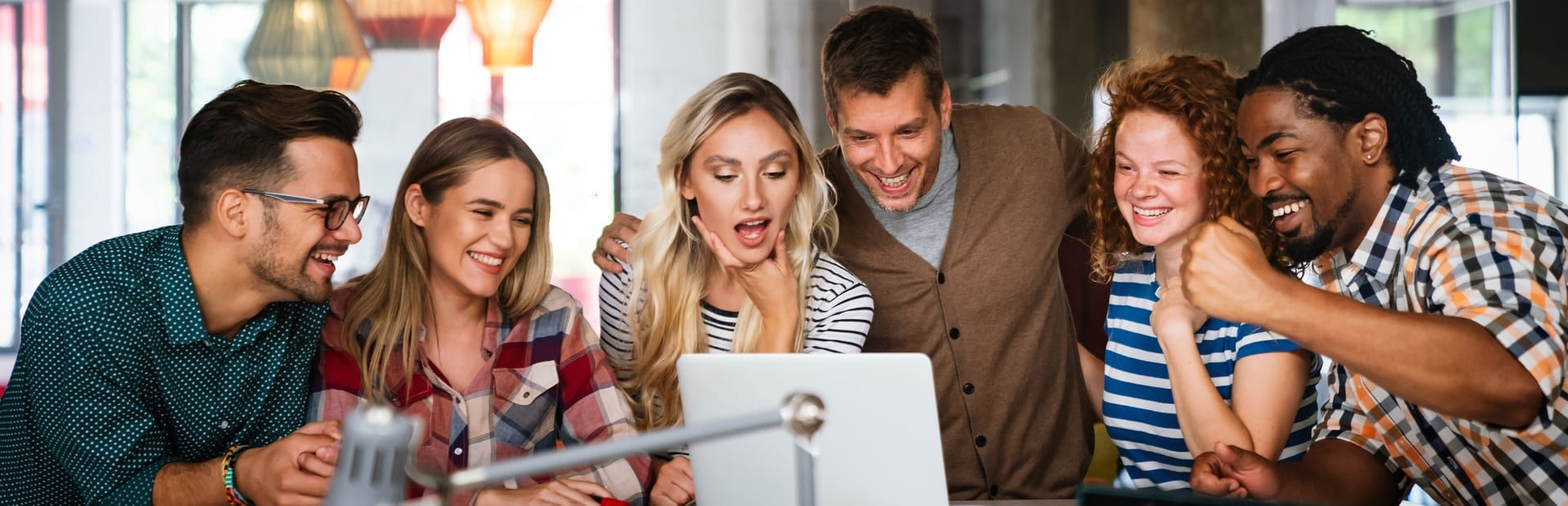 Coworkers celebrating, representing TP’s PR on being recognized as 2023 Company of the Year in Peru.