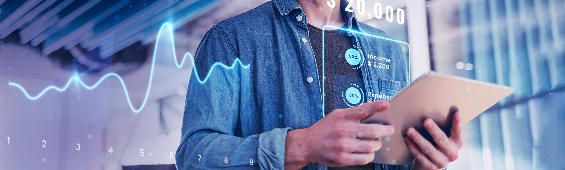A person uses a tablet while interacting with a holographic financial interface displaying income, expenses, and a fluctuating data graph.