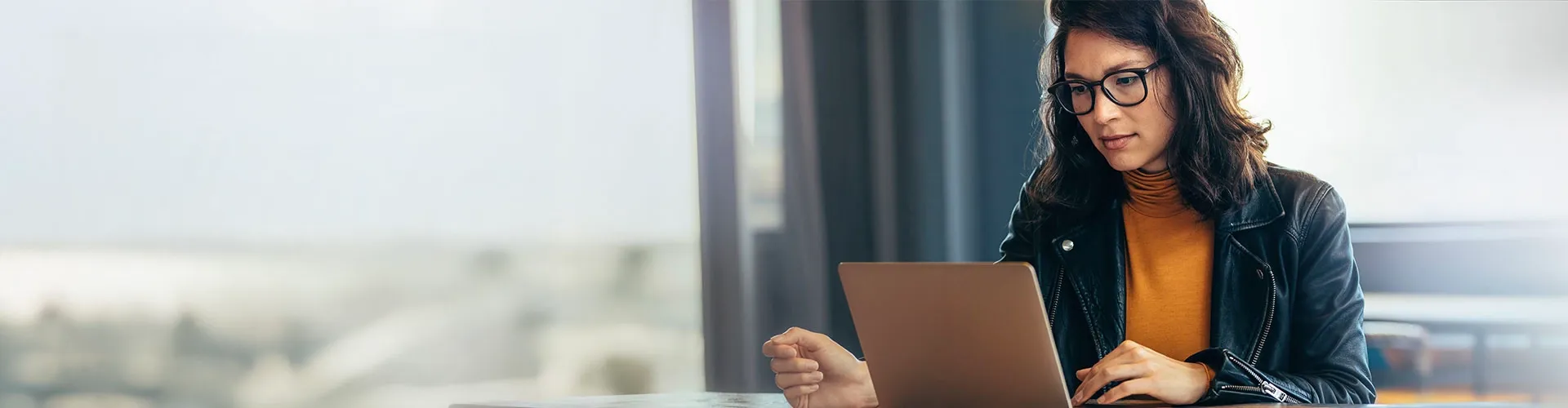 Serious woman working on computer