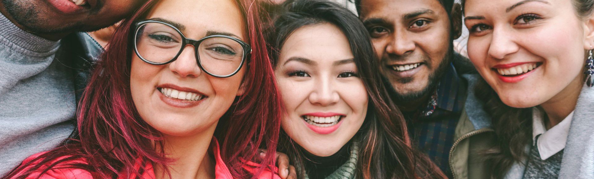 Group of TP employees smiling and enjoying a moment together.