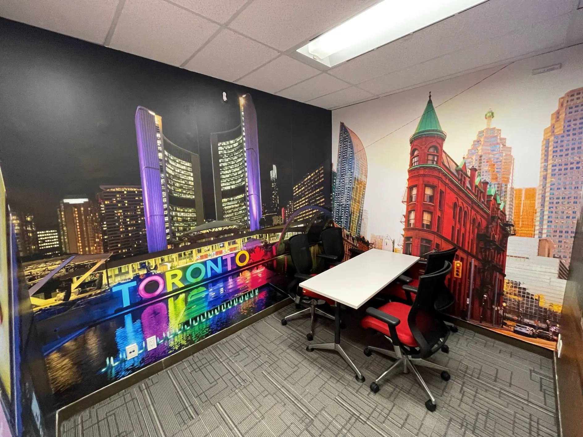 Small meeting room with Toronto cityscape wall murals