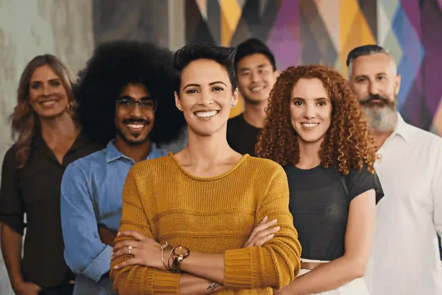 Diverse group of office workers with their arms crossed 