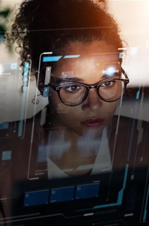 Analyst reviewing real-time data dashboards on a digital interface.