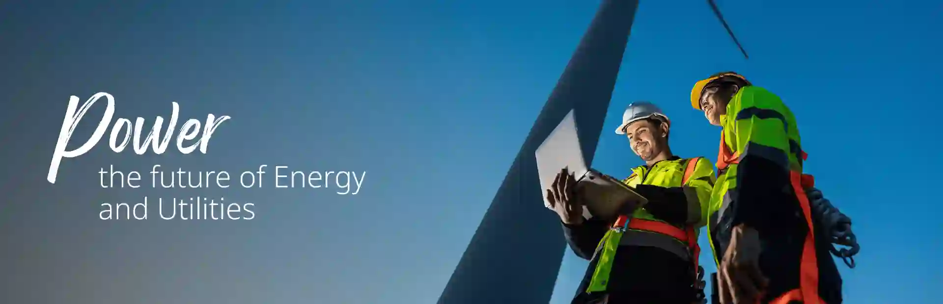 Wind power tower operators working on computer