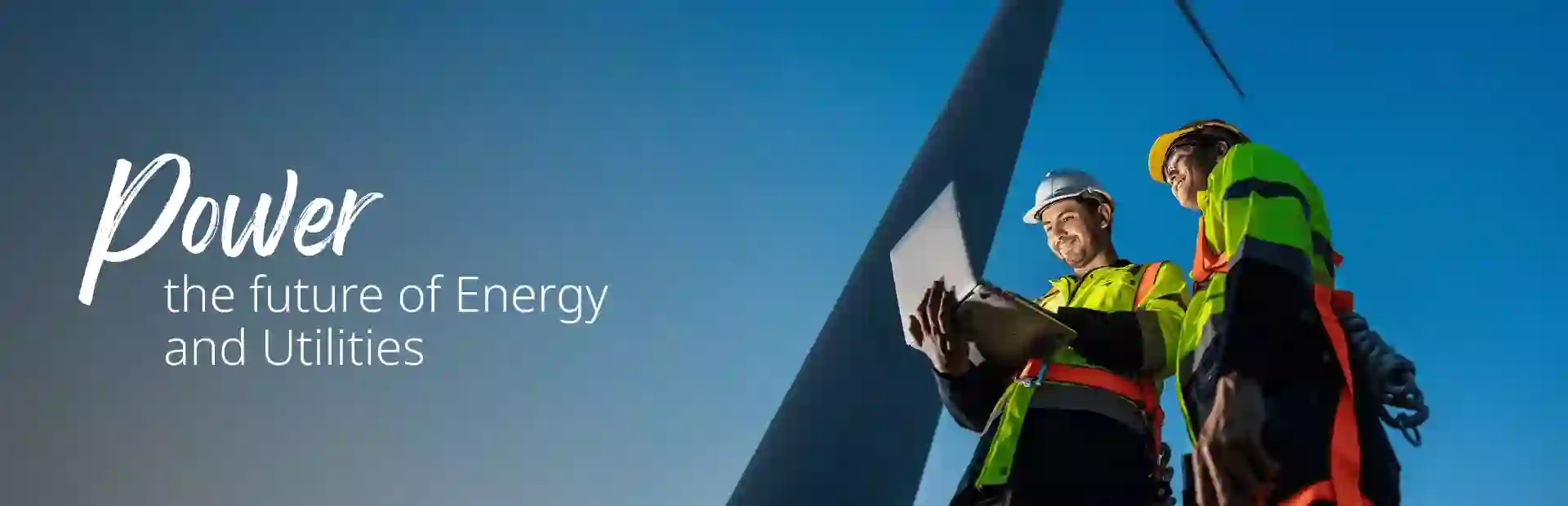 Wind power tower operators working on computer