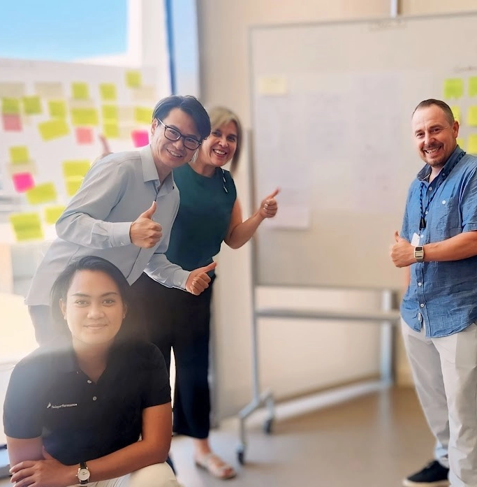 TP employees waving to the camera