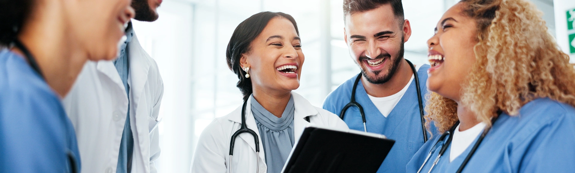Healthcare professionals sharing a joyful moment together.