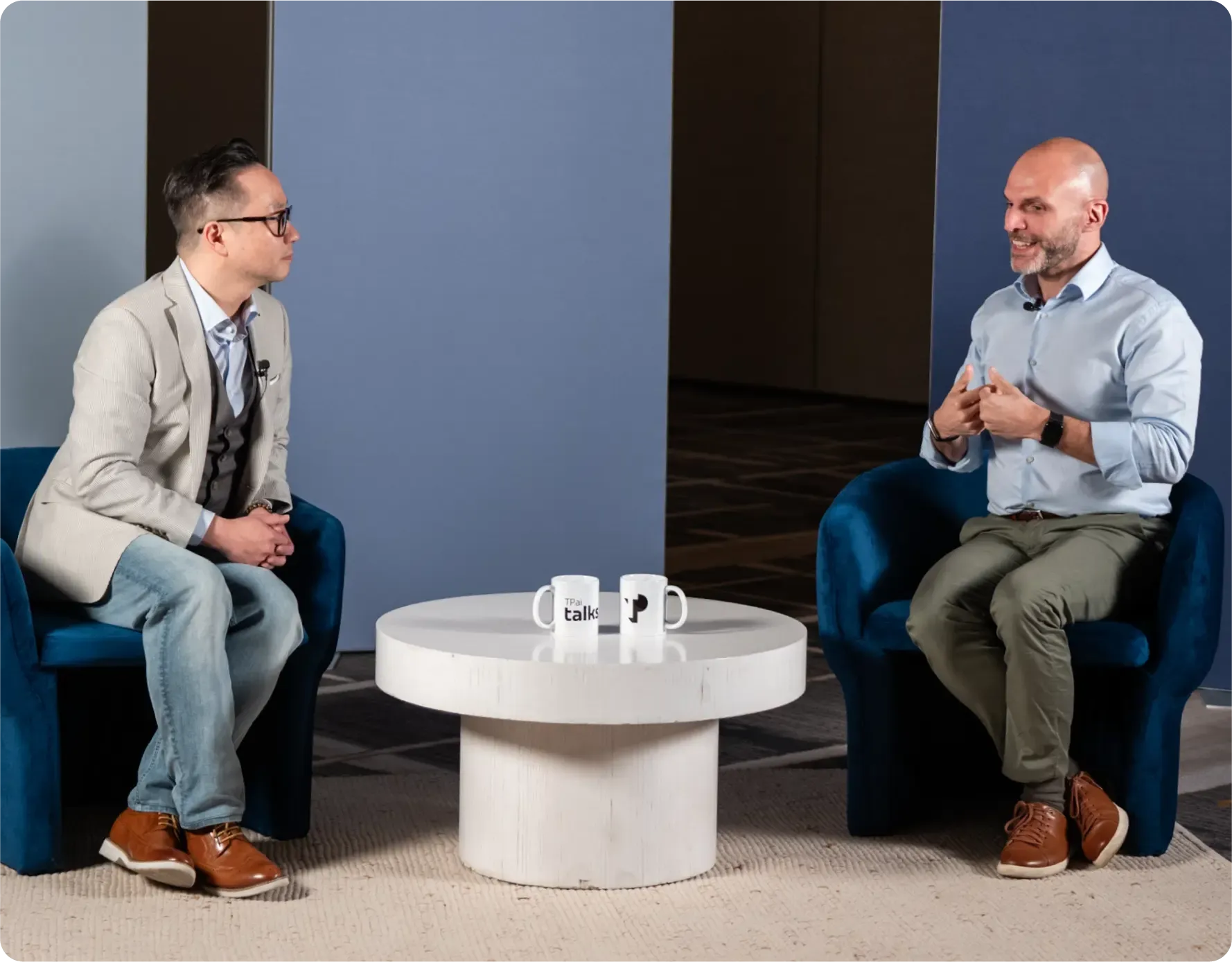 TP AI Talks interview featuring two business leaders discussing AI innovation.