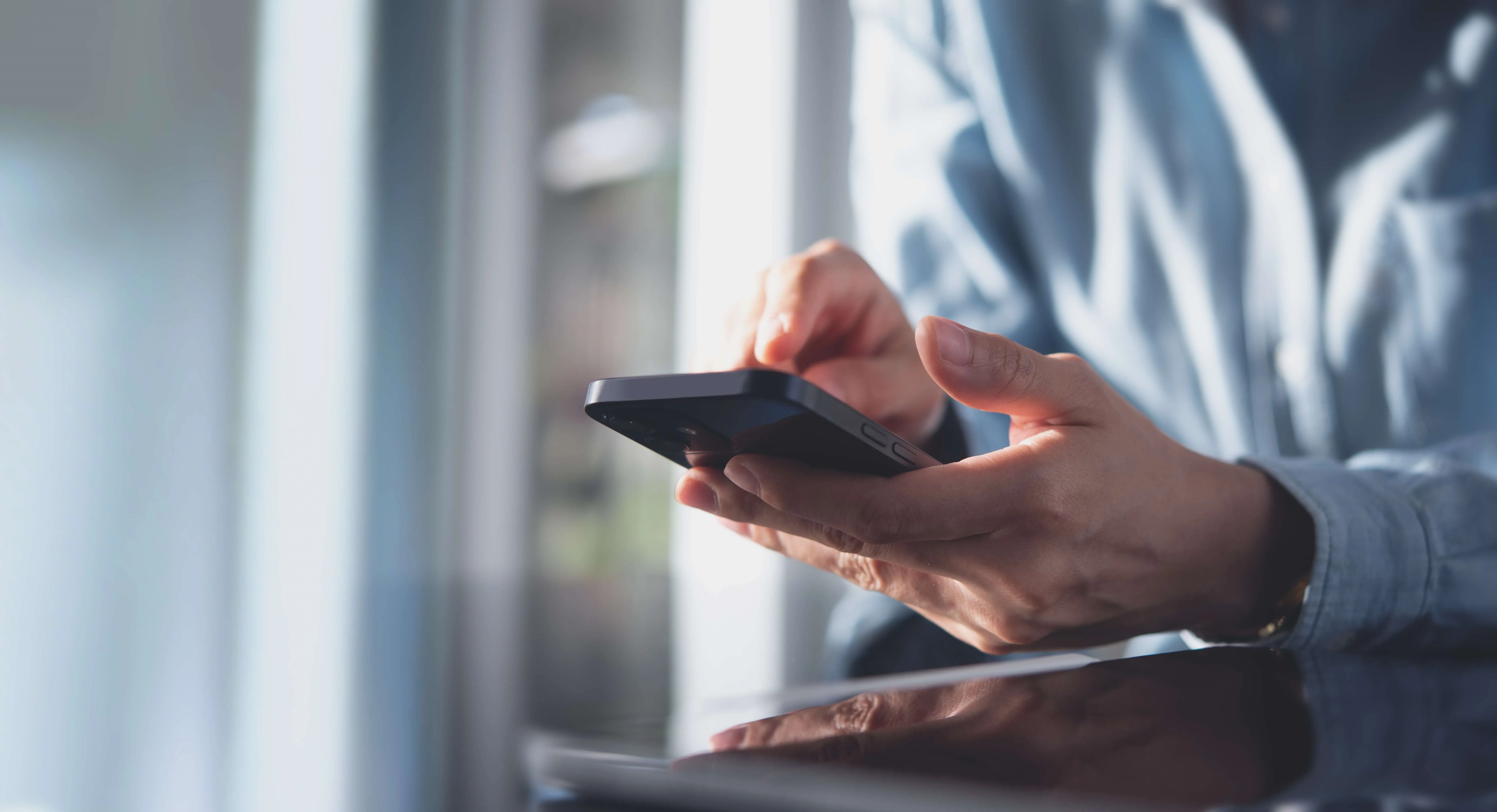 Hand holding cellphone in Trust and safety TP