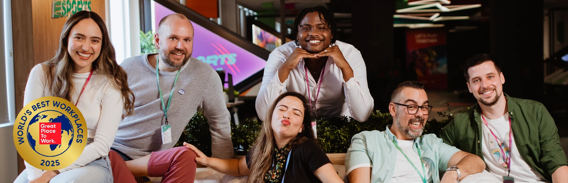 Team members celebrate a shared achievement, marking TP’s Top 10 World’s Best Workplaces 2025.