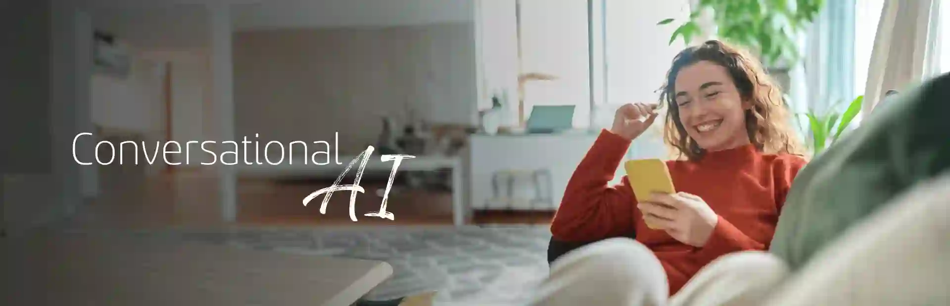 Smiling woman sitting comfortably on her sofa and browsing her cellphone