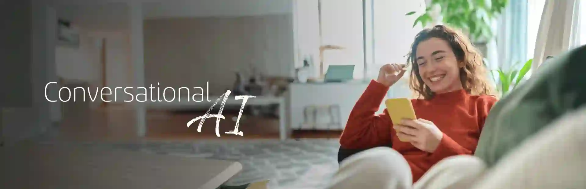 Smiling woman sitting comfortably on her sofa and browsing her cellphone