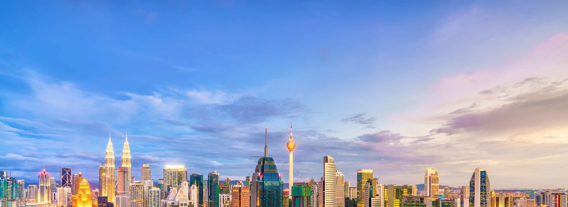 Several buildings with a blue sky behind them