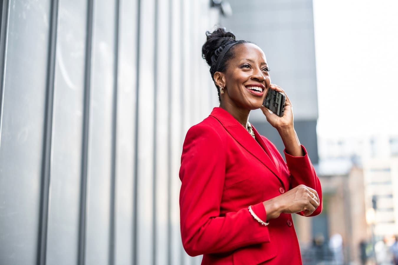 African business woman talking on the phone on a the streets