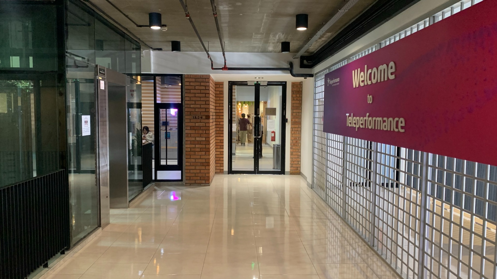 Office hallway with large Welcome to TP sign on wall