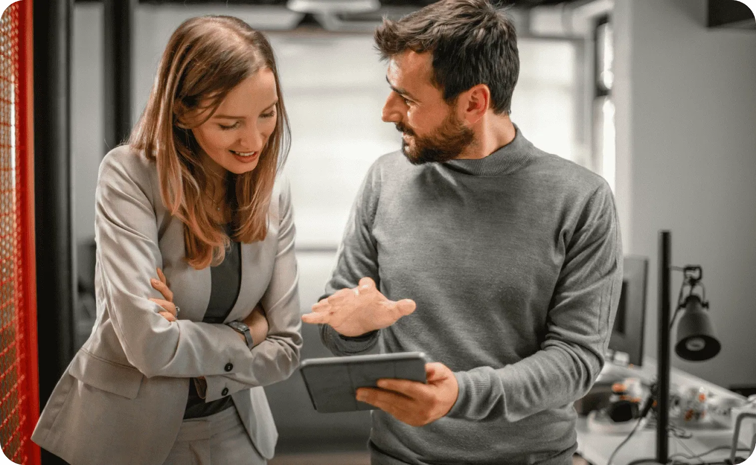 Two business people having a conversation at the office