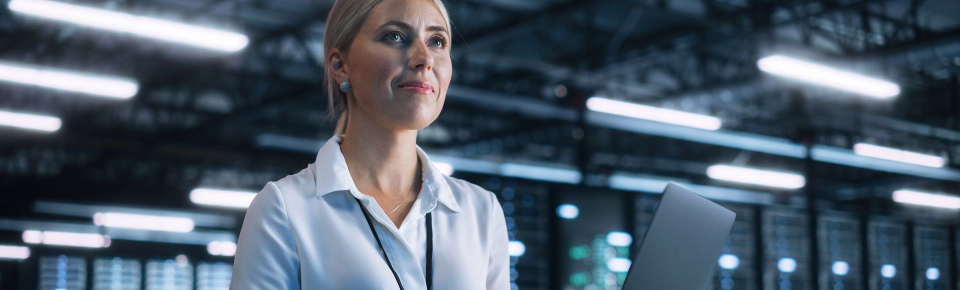 Blonde woman looking ahead as if envisioning the future through modern technological solutions, illustrating a blog on AWS Lambda as an unexpected cloud hero.