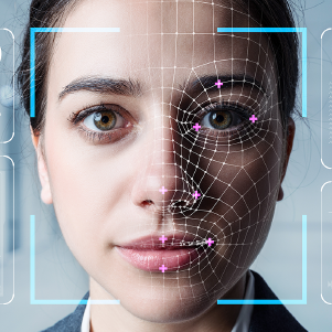 a woman's face is overlaid with a digital facial recognition grid, highlighting key facial features. blue square brackets frame her face, set against a blurred, neutral background.