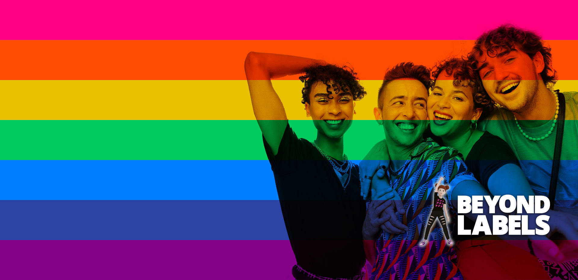 Group of four smiling people embracing against a rainbow-striped background, with the words 'Beyond Labels' written in bold white letters on the right.