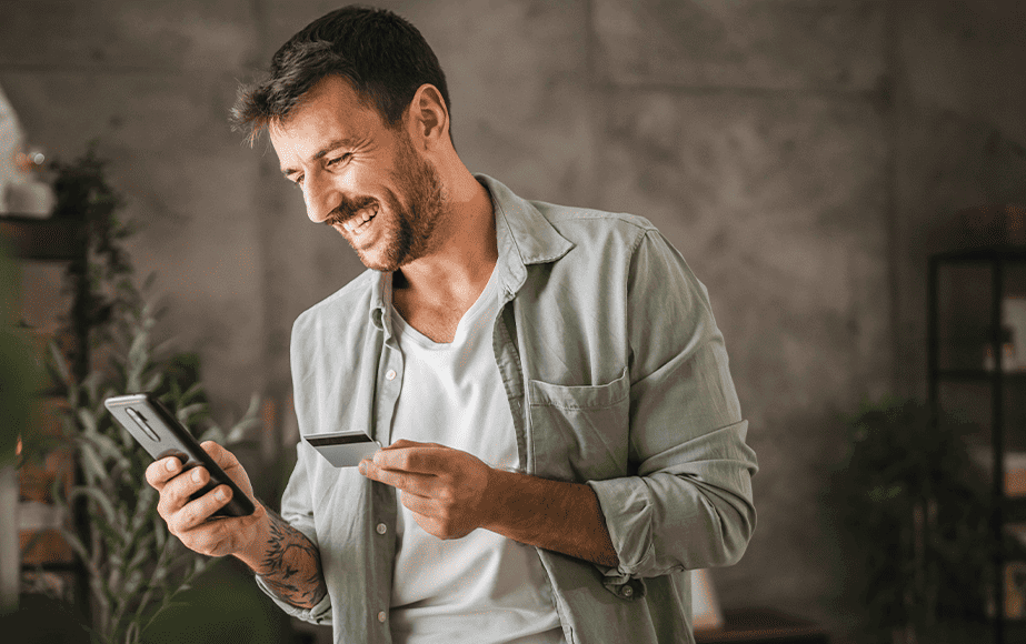 Debt Collections case study cover depicting a smiling man holding his cellphone and his credit card